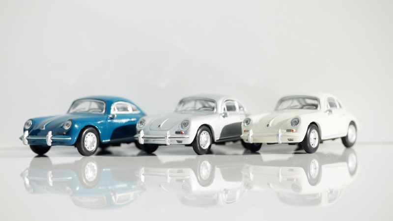 Illustration for article titled Kyosho Porsche 1 1/64 #84 - Projekt RennSport Käfer #2 - 1965 Porsche 356 C Coupe